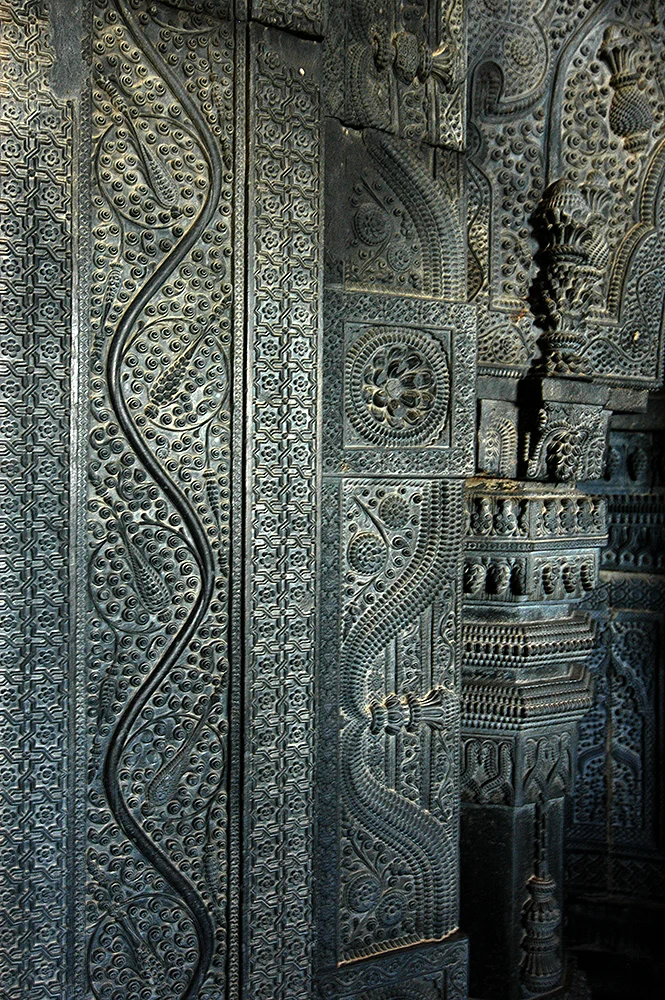 Wall adorned with beautiful leaf and vine carvings